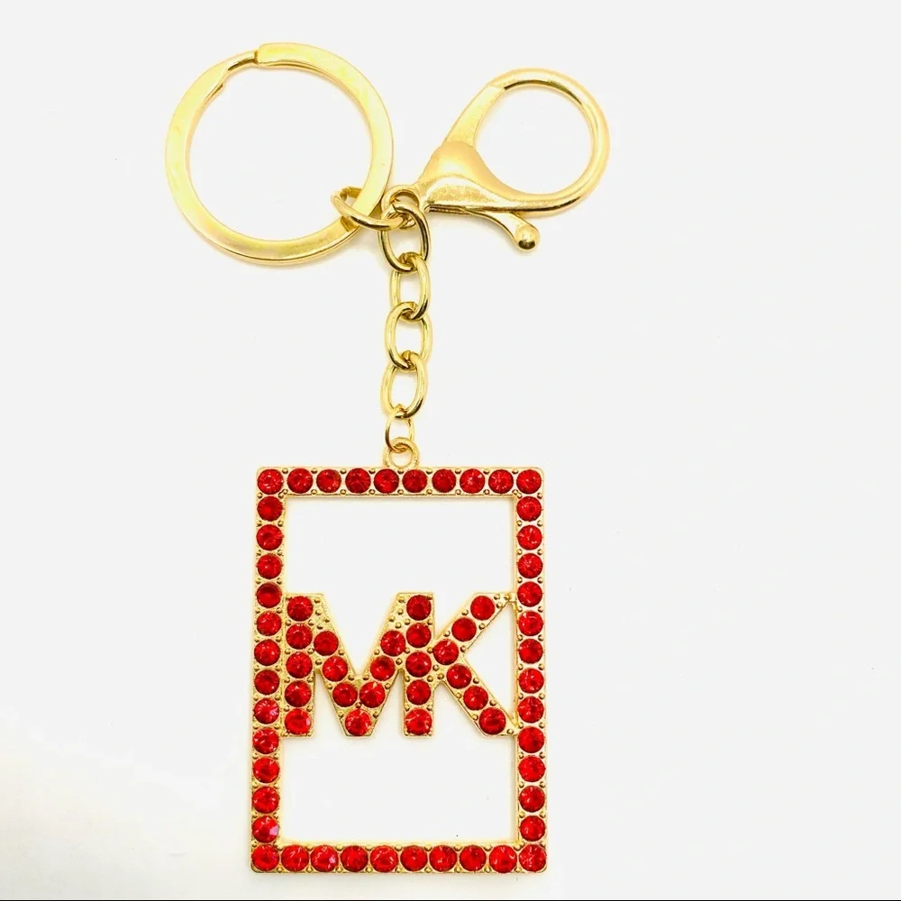 Purse Charm Key Chain MK in Red Crystals set in golden tone.